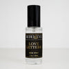A bottle of 'Love Letters' room spray with a black cap and a label that includes the product name and the scent, peony, written in a stylish font.